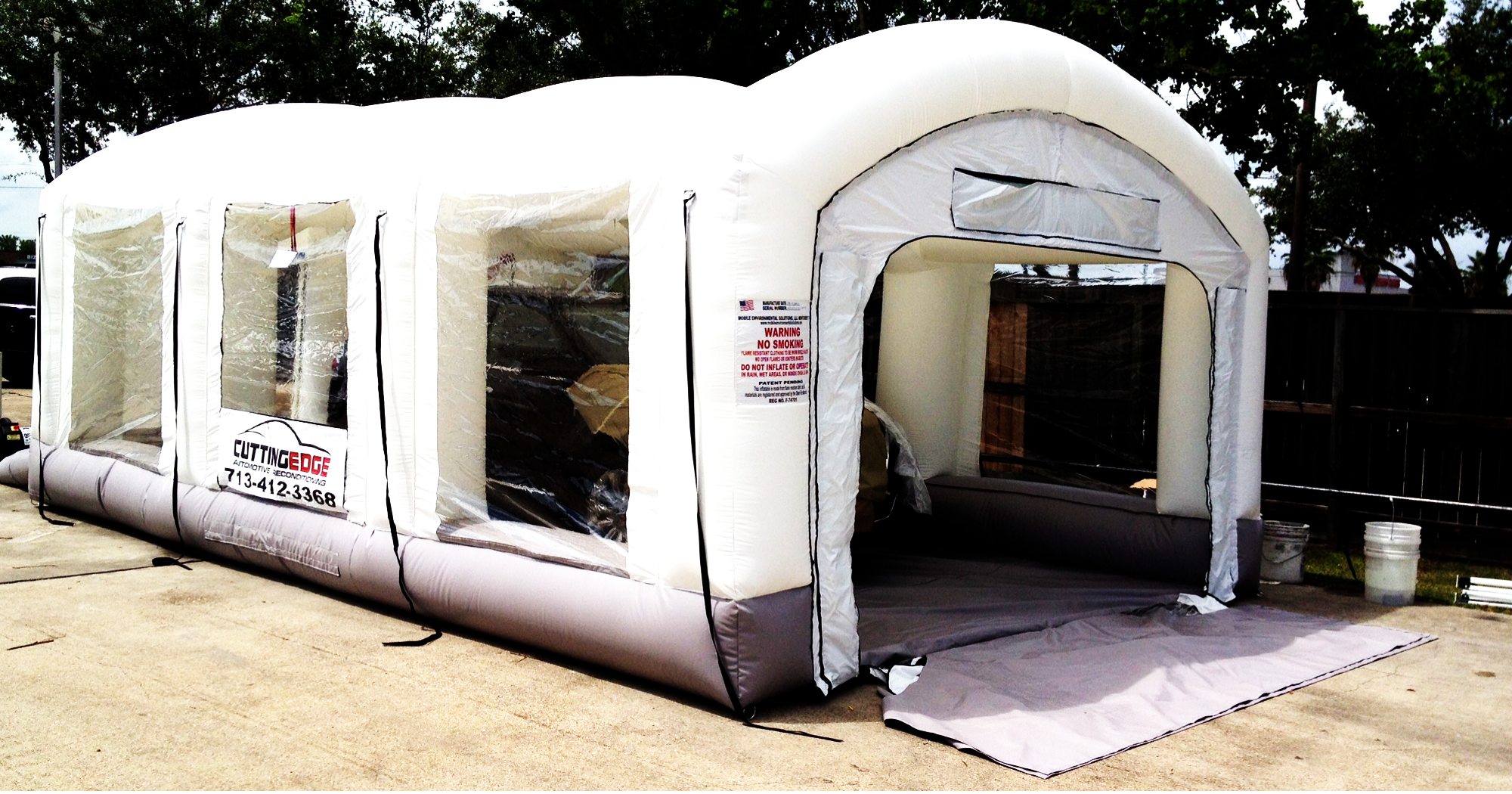 white booth with vehicle inside